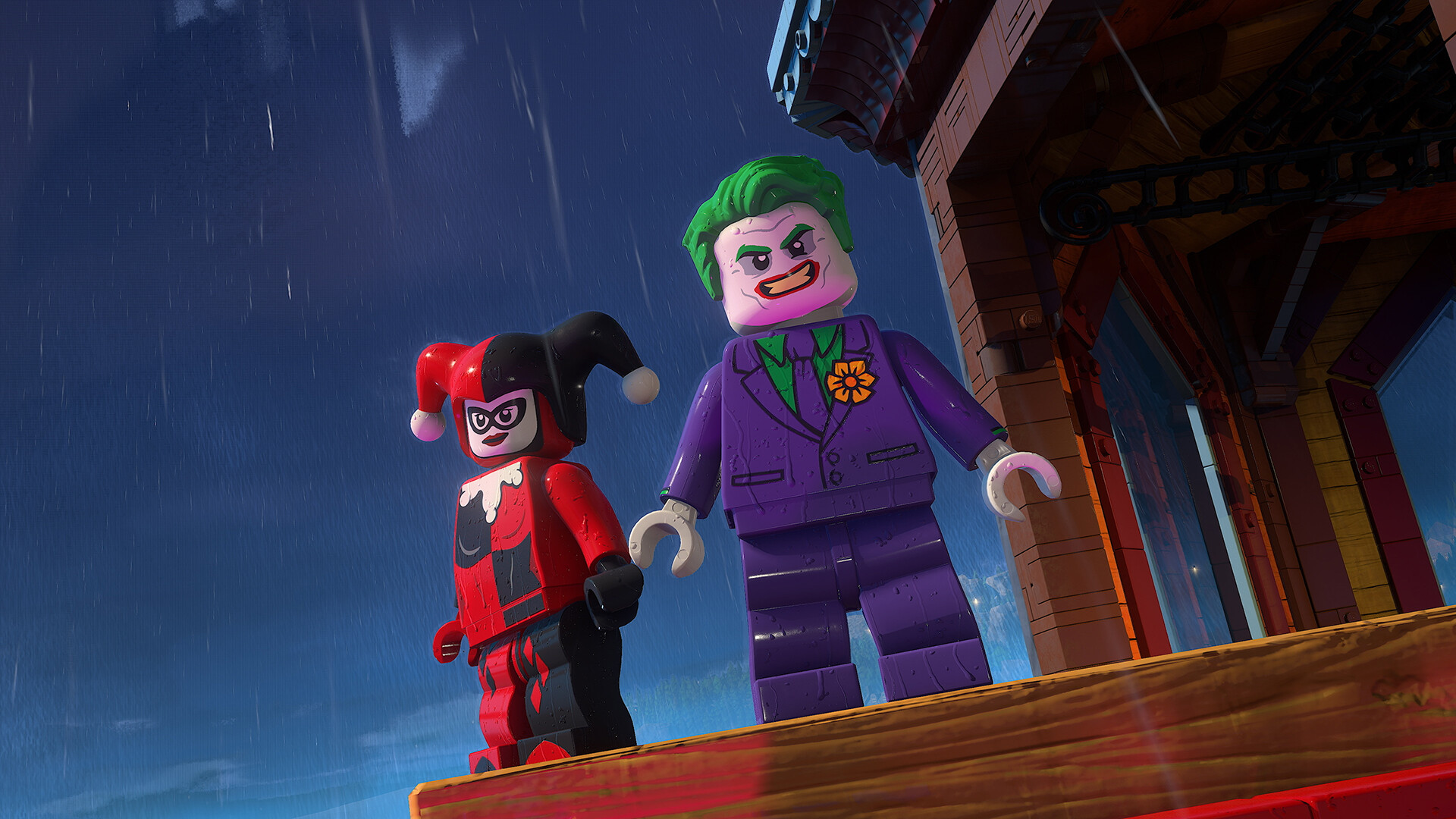 Joker e Harley Quinn insieme su un edificio di Gotham — LEGO Batman: Legacy of the Dark Knight. Immagine generale del pacchetto Deluxe; non rappresenta necessariamente la nuova missione.